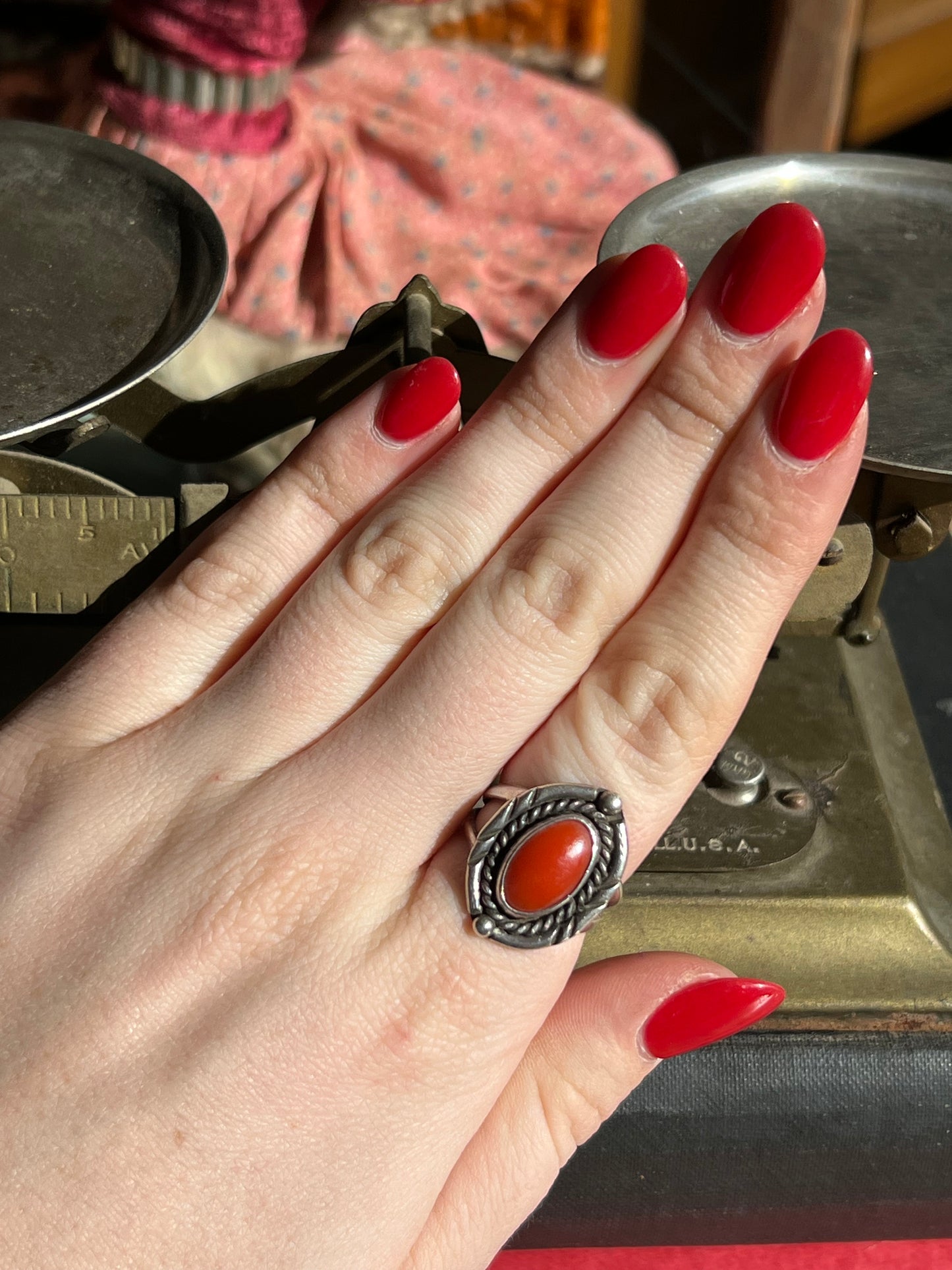 Coral Stone Ring with Braided Frame